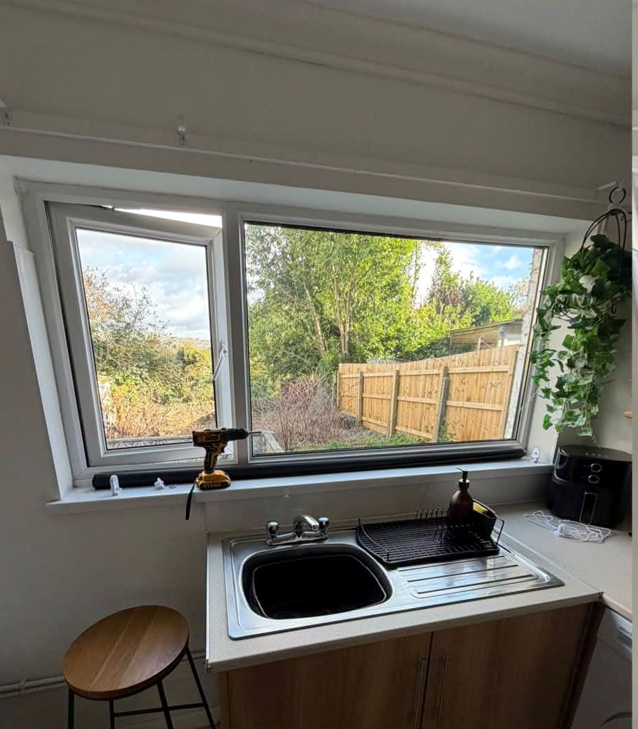 Kitchen window above a sink with no blind fitted