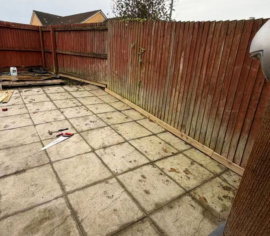 Wide view of the yard and fence after the job