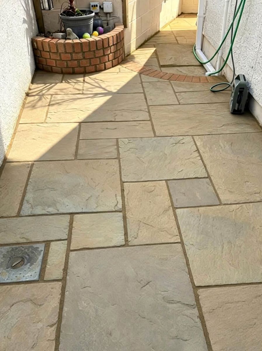 Same patio power washed, clean sandstone colour